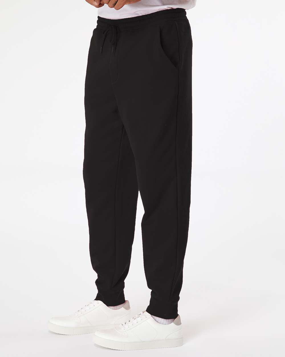 Side view of black unisex fleece joggers from The Bronze Collective showing the side pocket and relaxed fit