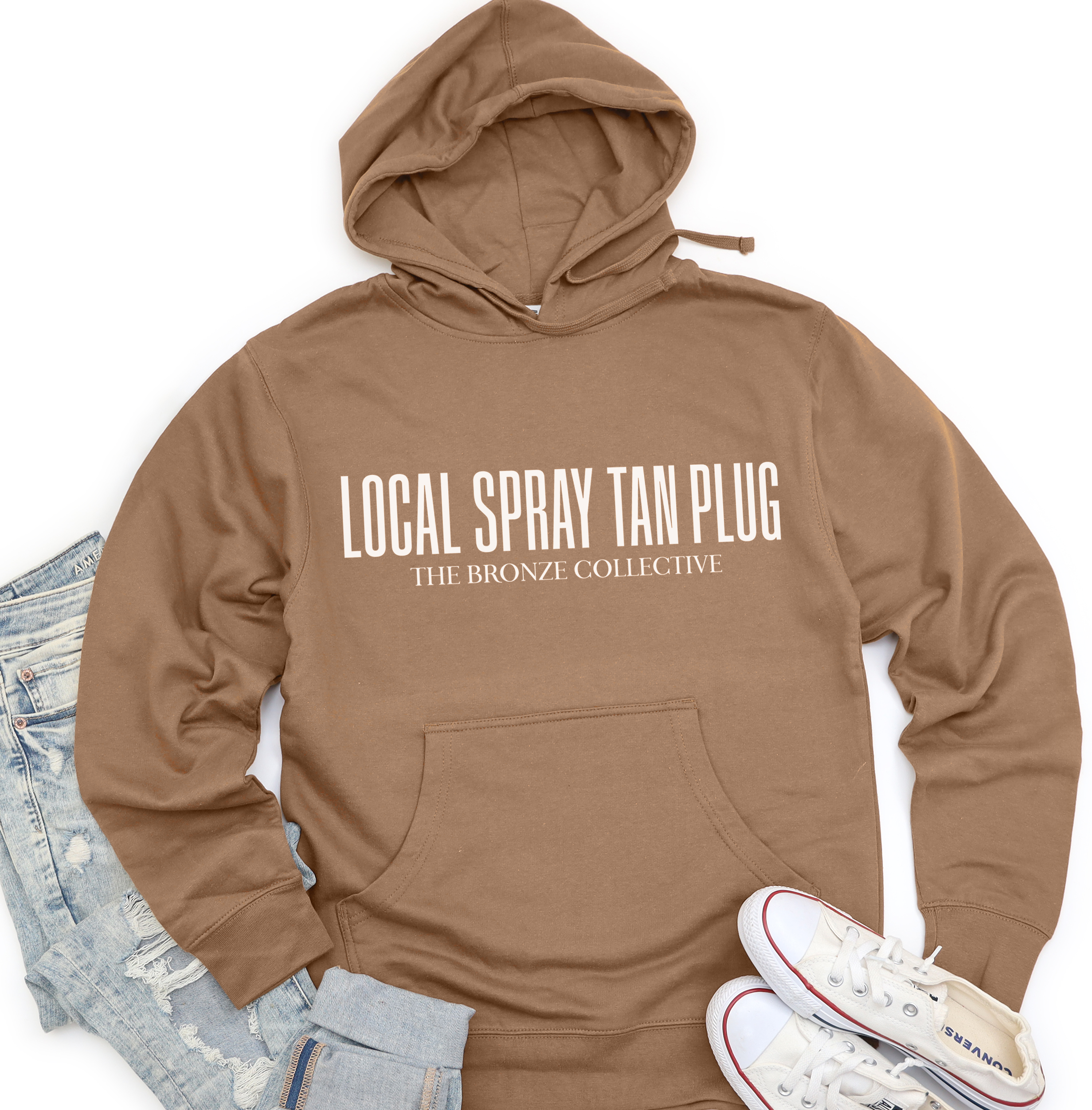 Saddle brown Local Spray Tan Plug hoodie by The Bronze Collective with cream print across the chest